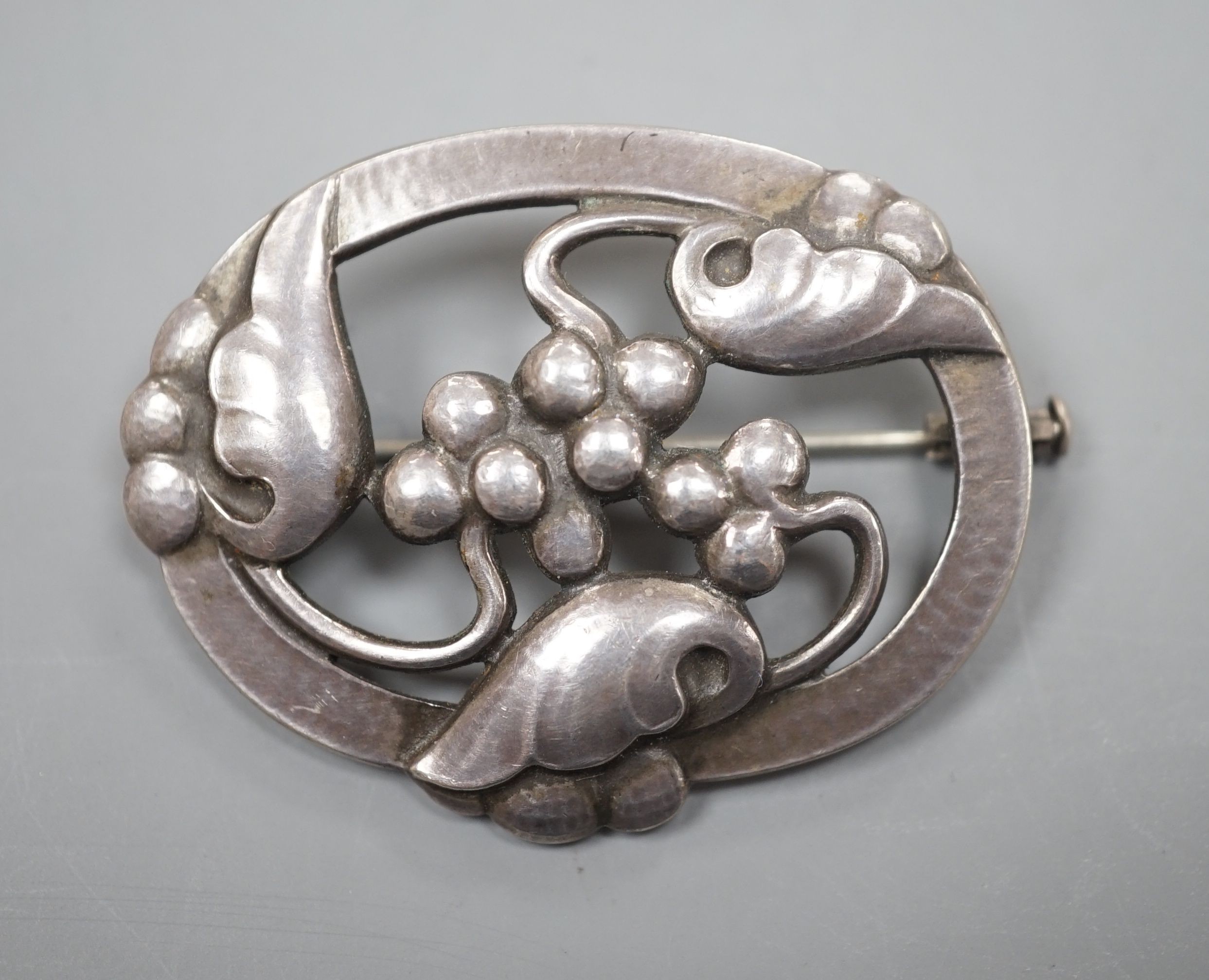 A Georg Jensen sterling 'Moonlight Grapes' oval brooch, no. 101, 42mm.